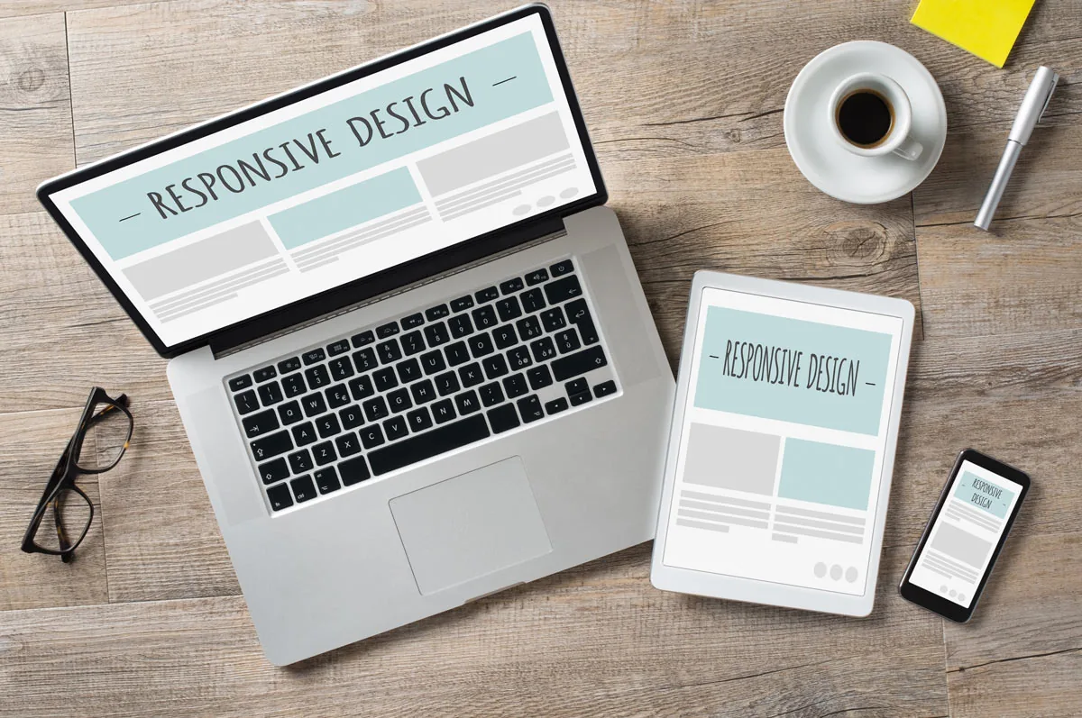 Responsive website design shown across laptop, tablet and phone