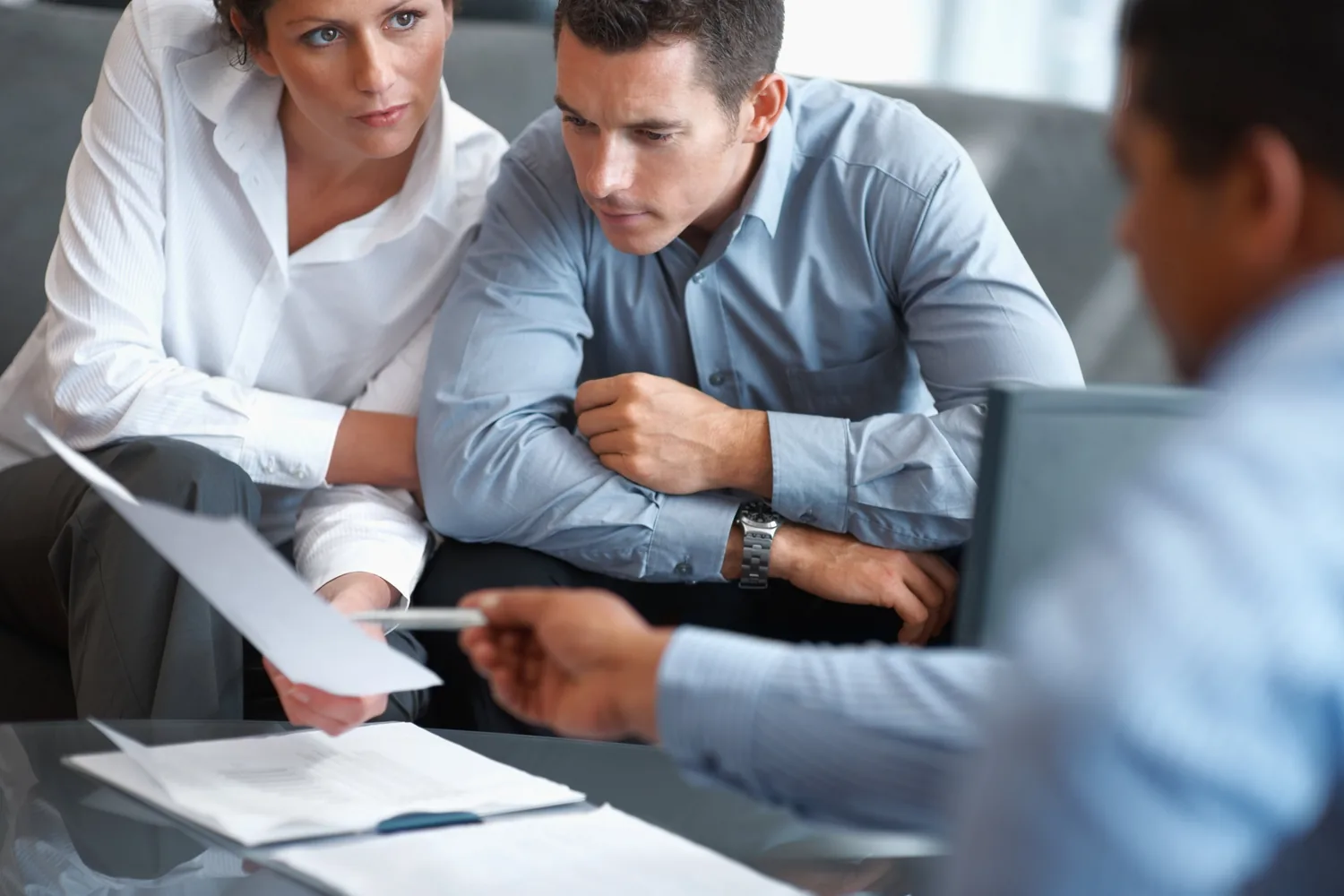 Advisers reviewing documents with a client