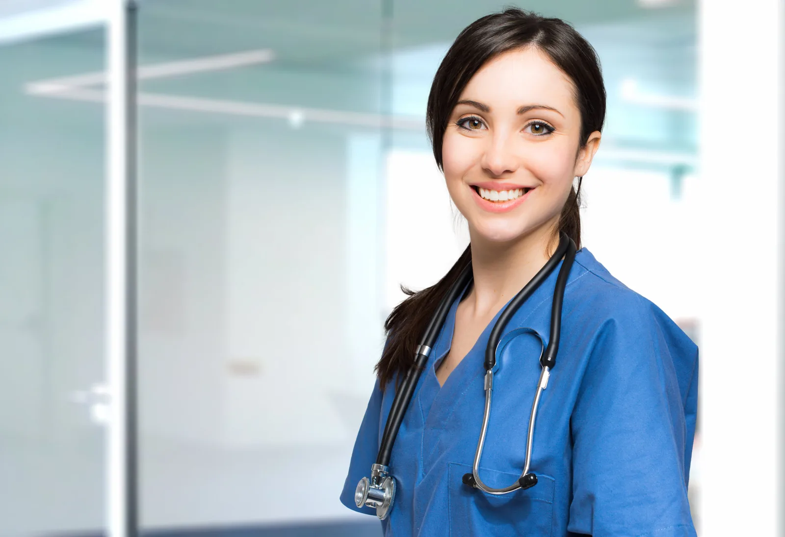 Dental clinician smiling in a bright modern practice